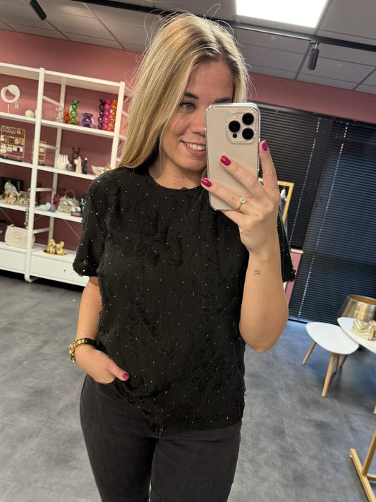 T-shirt met ruffles en steentjes