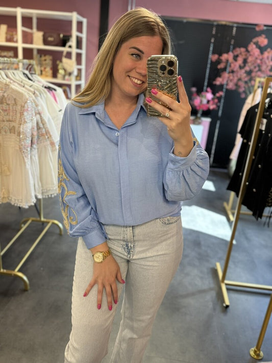 Blouse blauw met gouden details