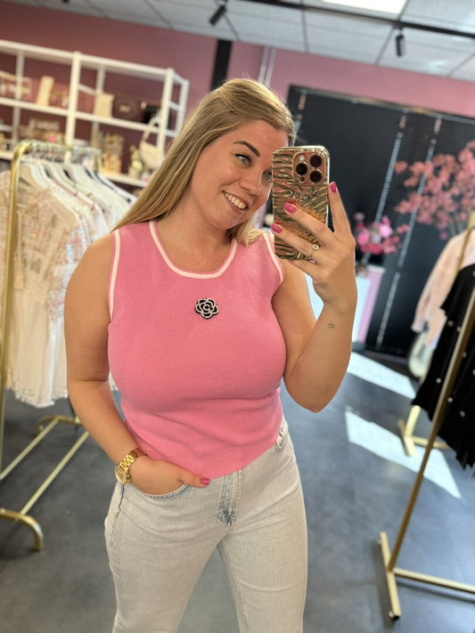 Roze top met een roosje